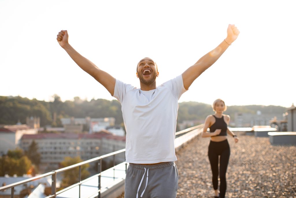 A couple running and exercising for overcoming the physical dependence on nicotine.