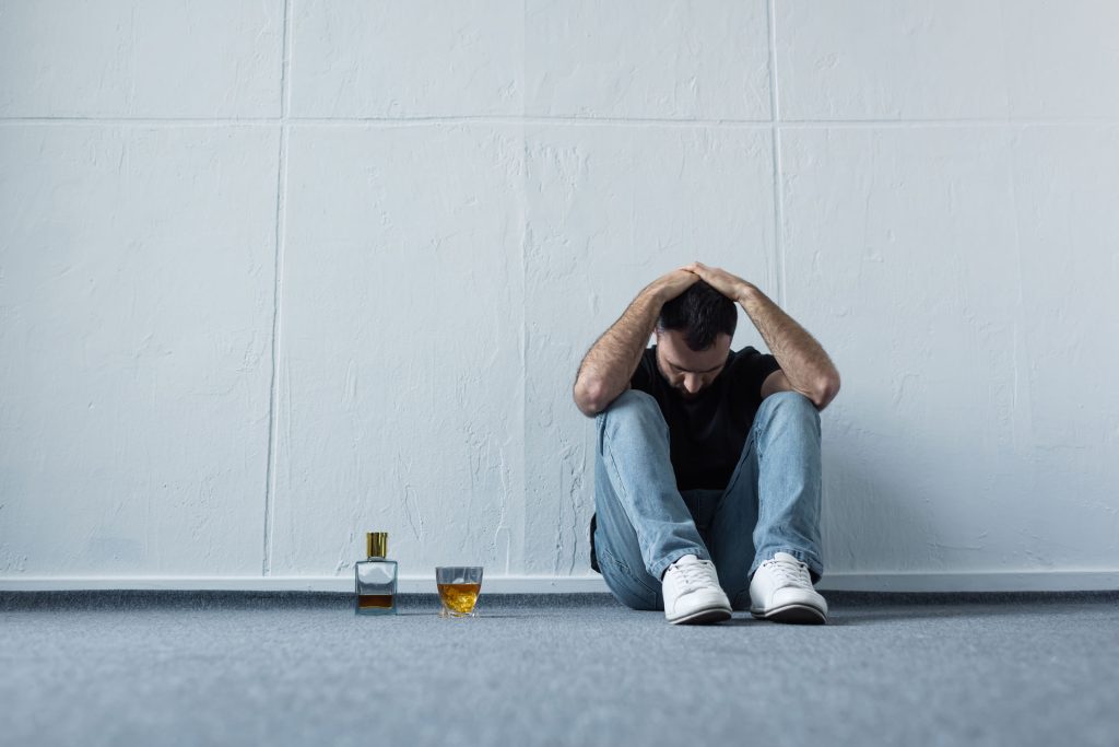 Depressed man sitting alone.