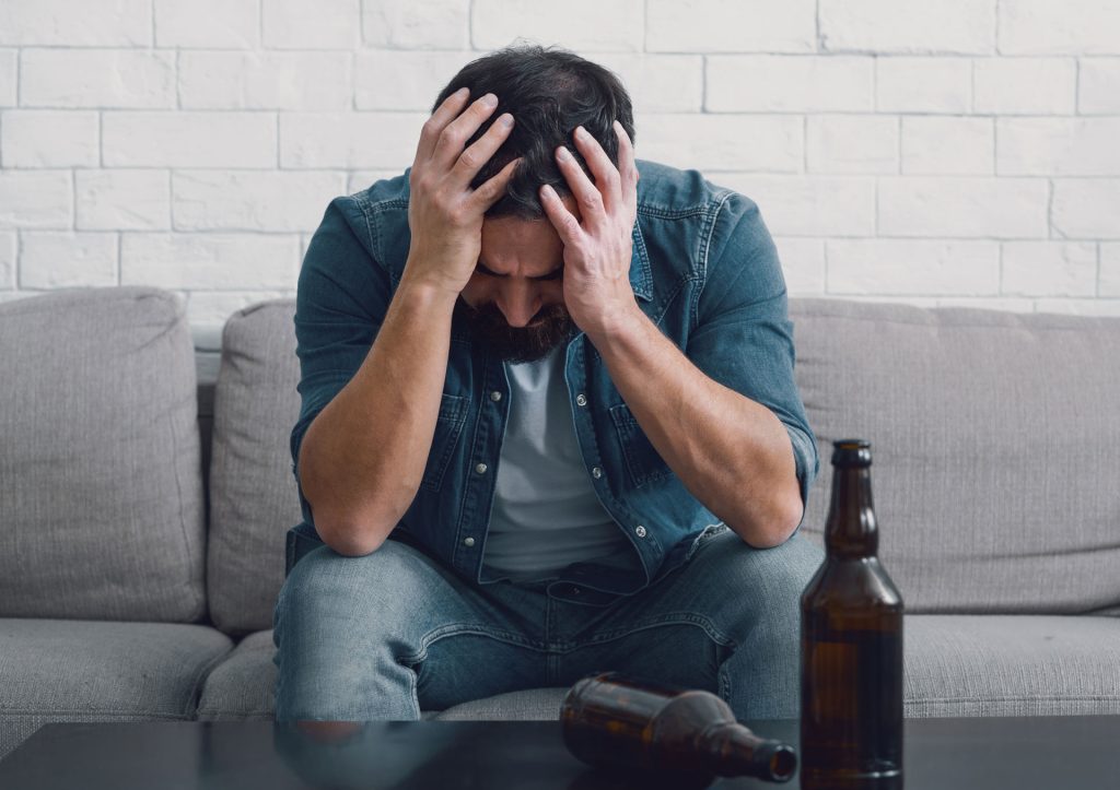 Sad man with poor mental health and substance use disorders.