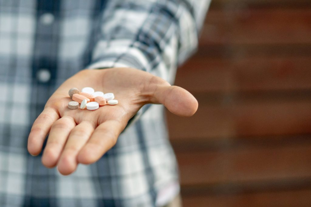 Man taking Medication-Assisted Treatment.