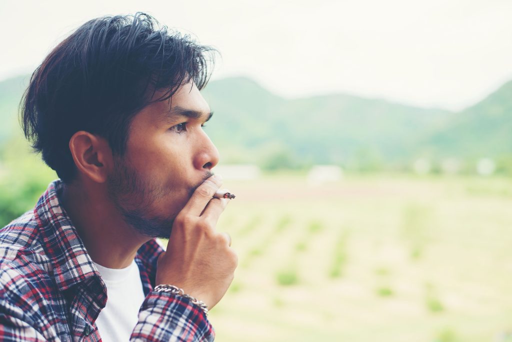 Man smoking a cigarette.