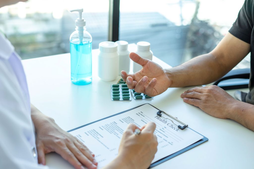 Patient asking the doctor about medication-assisted treatment during health checkup.