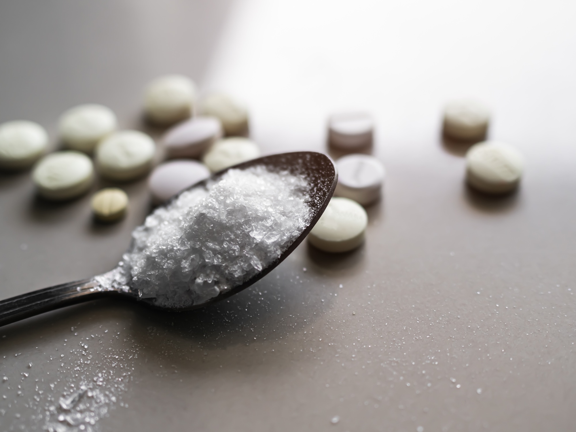 Amphetamine on Spoon with blur Pill and Overlight Background