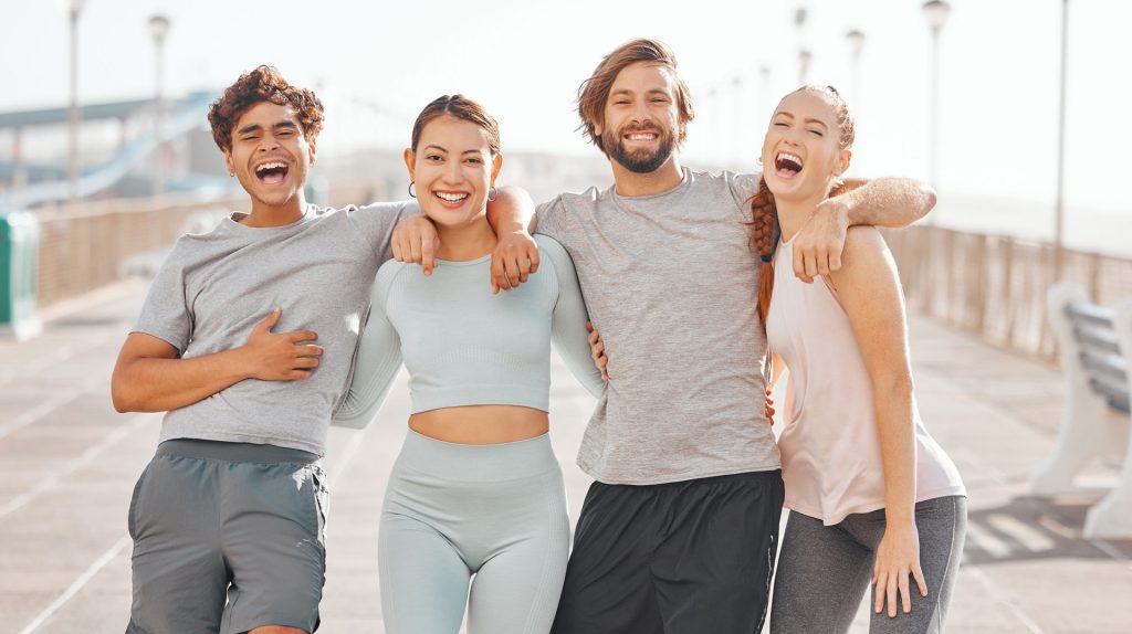 Happy fit friends outdoors.