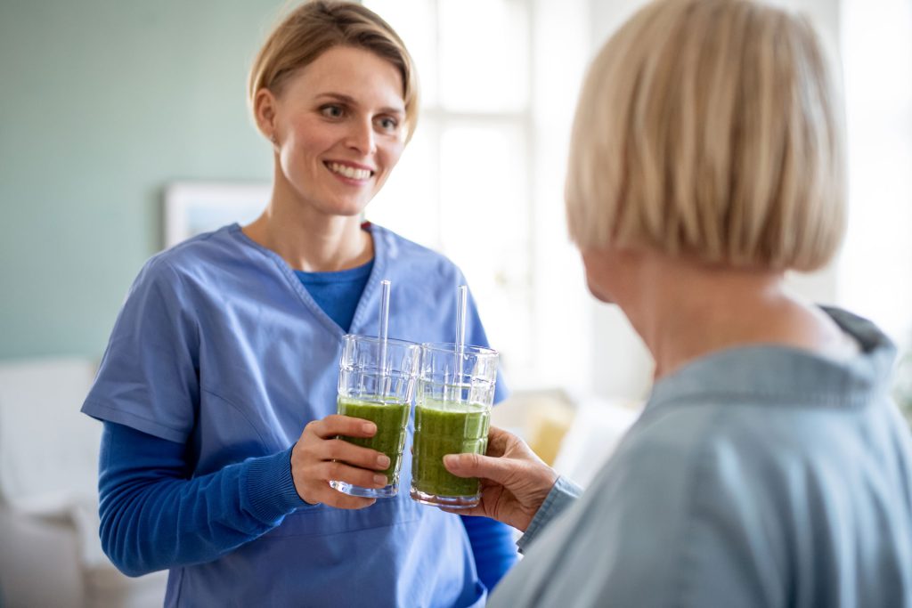 Senior woman drinking smoothie.