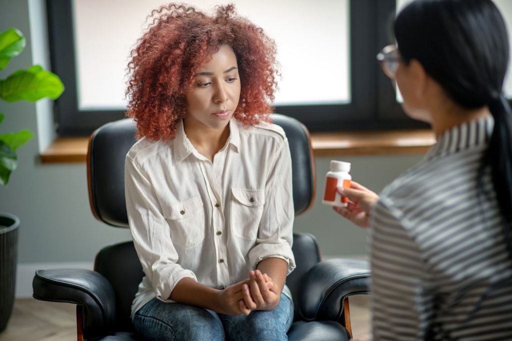 Psychiatrist talking to her patient.