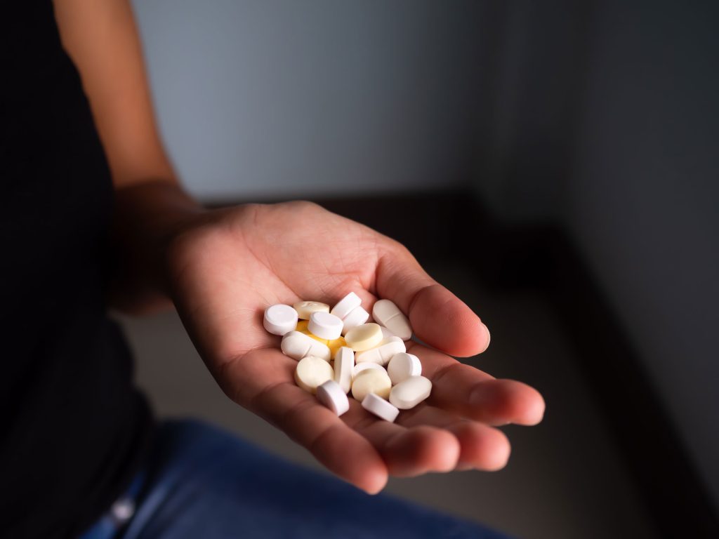 Drug on hand of a woman.