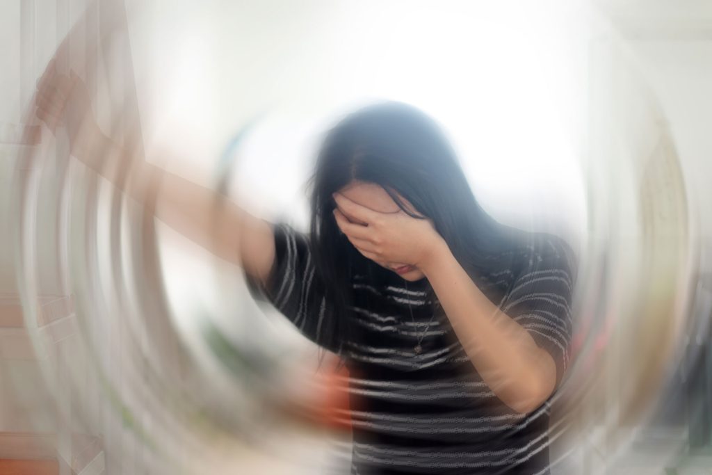 Woman suffering from vertigo.