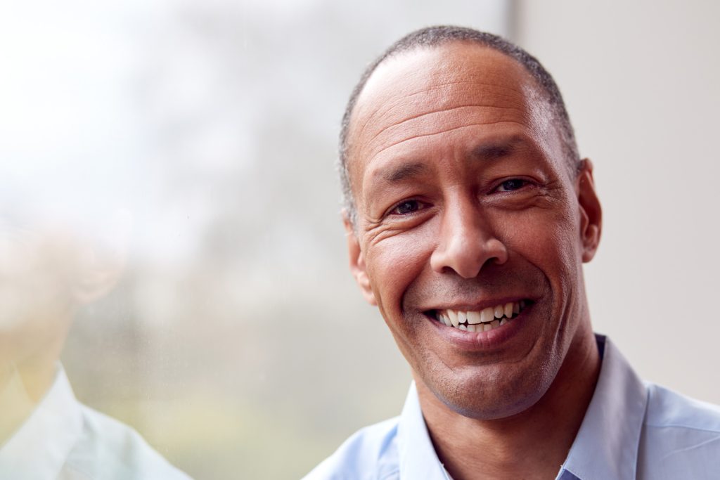 Smiling adult man.