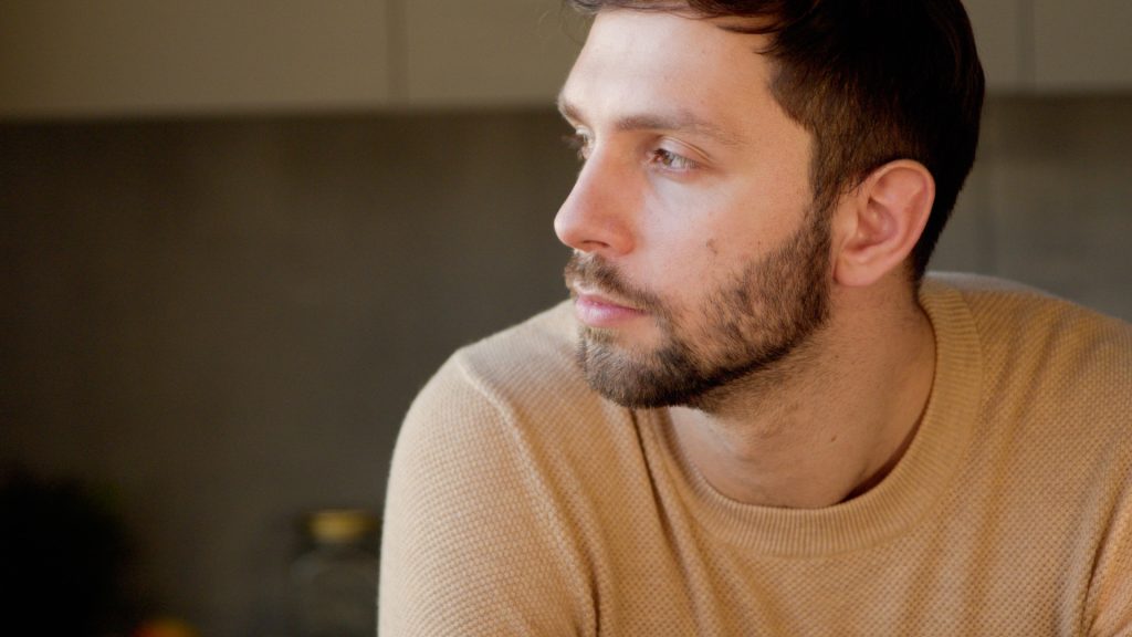 Young man thinking.